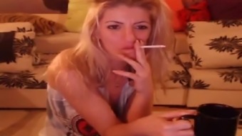 Smoking Blonde Stripteasing And Having Fun On Webcam