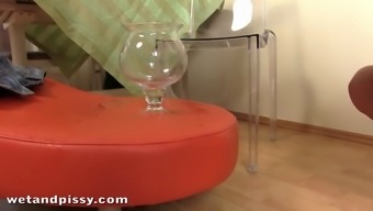 Pretty Pissing In A Large Transparent Glass