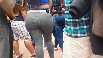Latina With A Large Buttocks In Grey Leggings Filmed Publicly